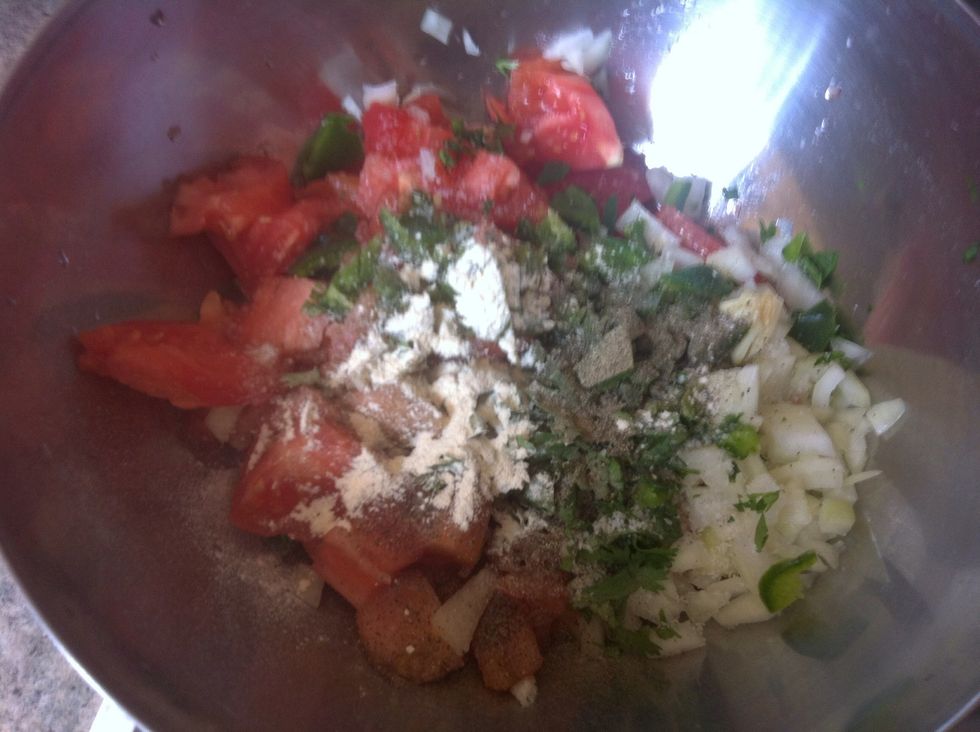 Put onion, garlic, tomato, jalape\u00f1o, cilantro, salt, pepper, garlic powder and cumin in a bowl and mix well