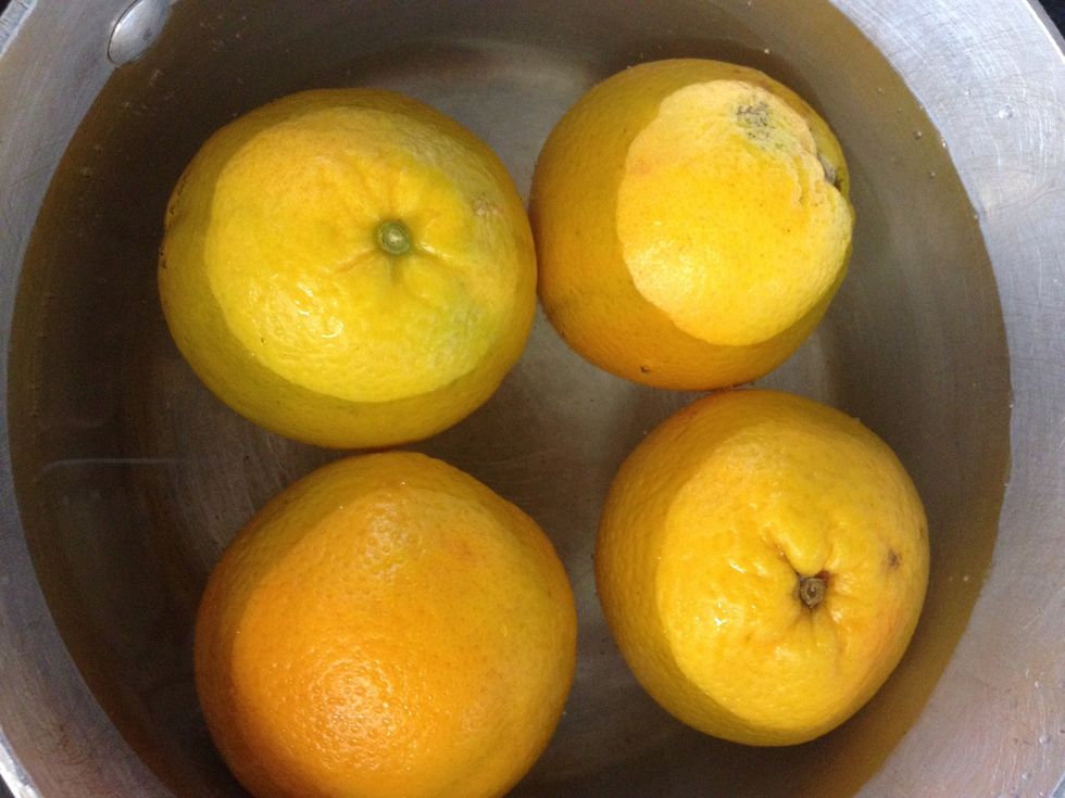 Put oranges in cold water bring to the boil and boil for 20 minutes