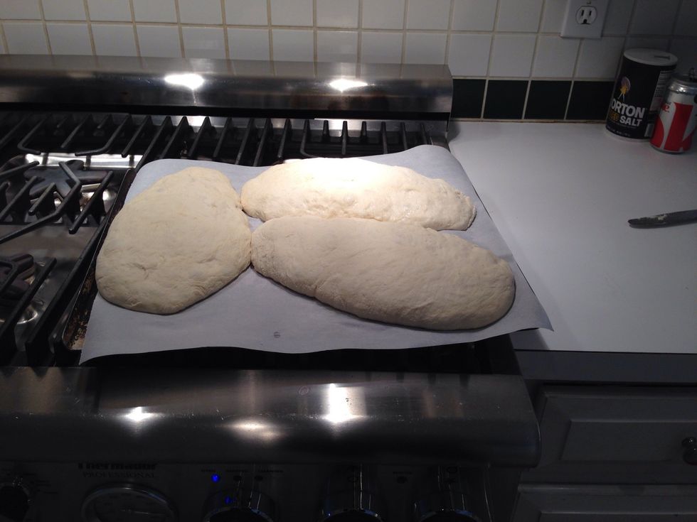 Put paper on a cookie sheet and shape the loaves. This dough is pretty soft- so don't worry about shaping them on the counter. They'll be pretty close but don't worry about that either. You'll see.