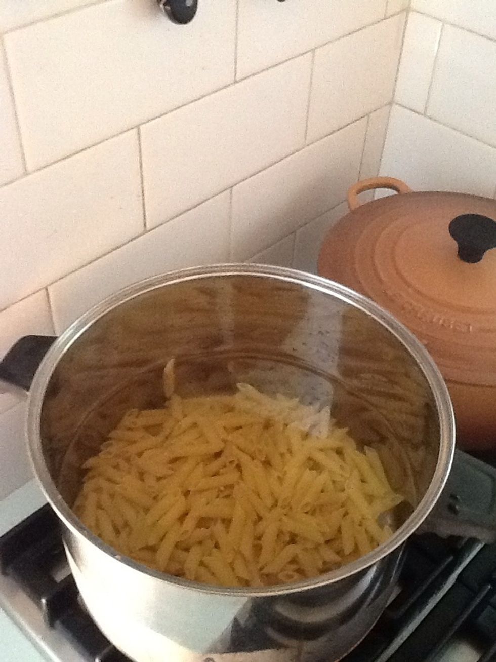 Put pasta in a pot of boiling water until it is cooked