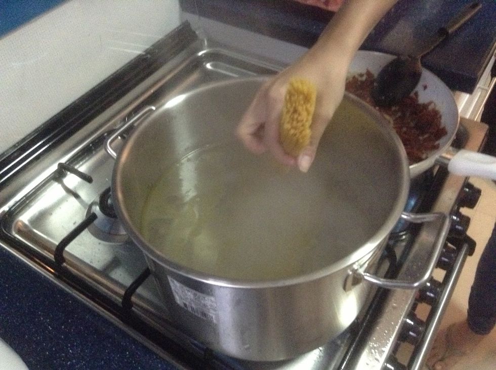 Put pasta in the water