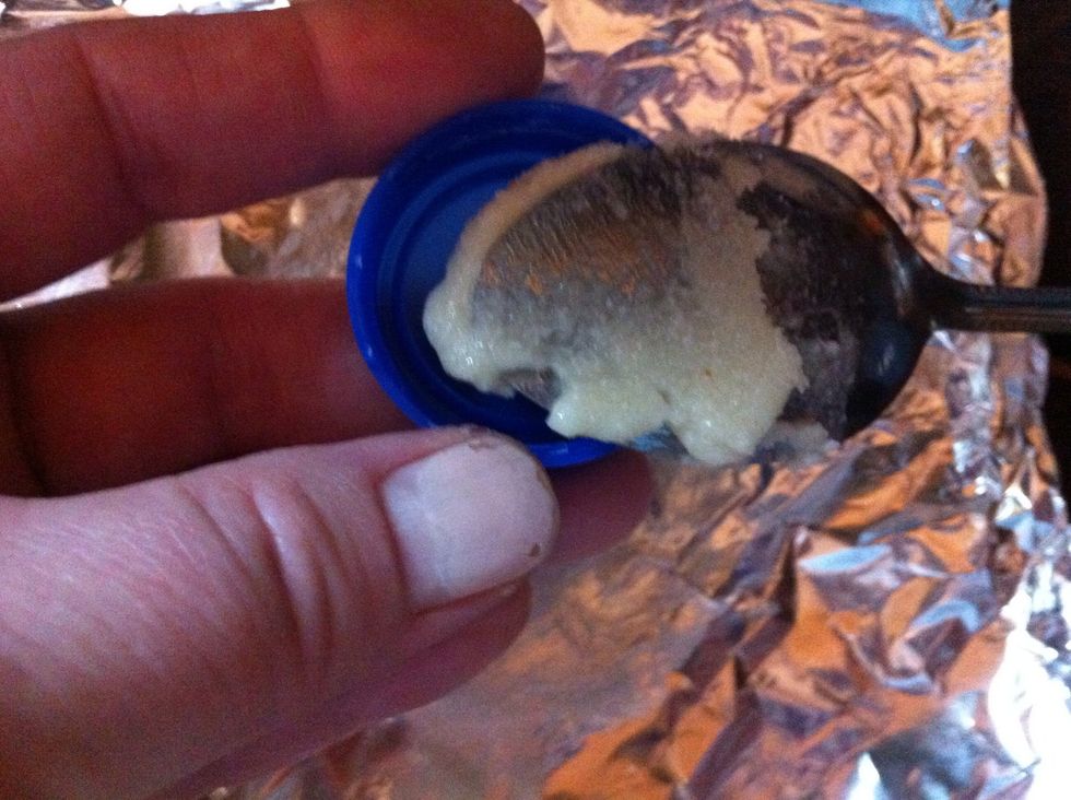 Put paste in plastic top. This is milk jug top.