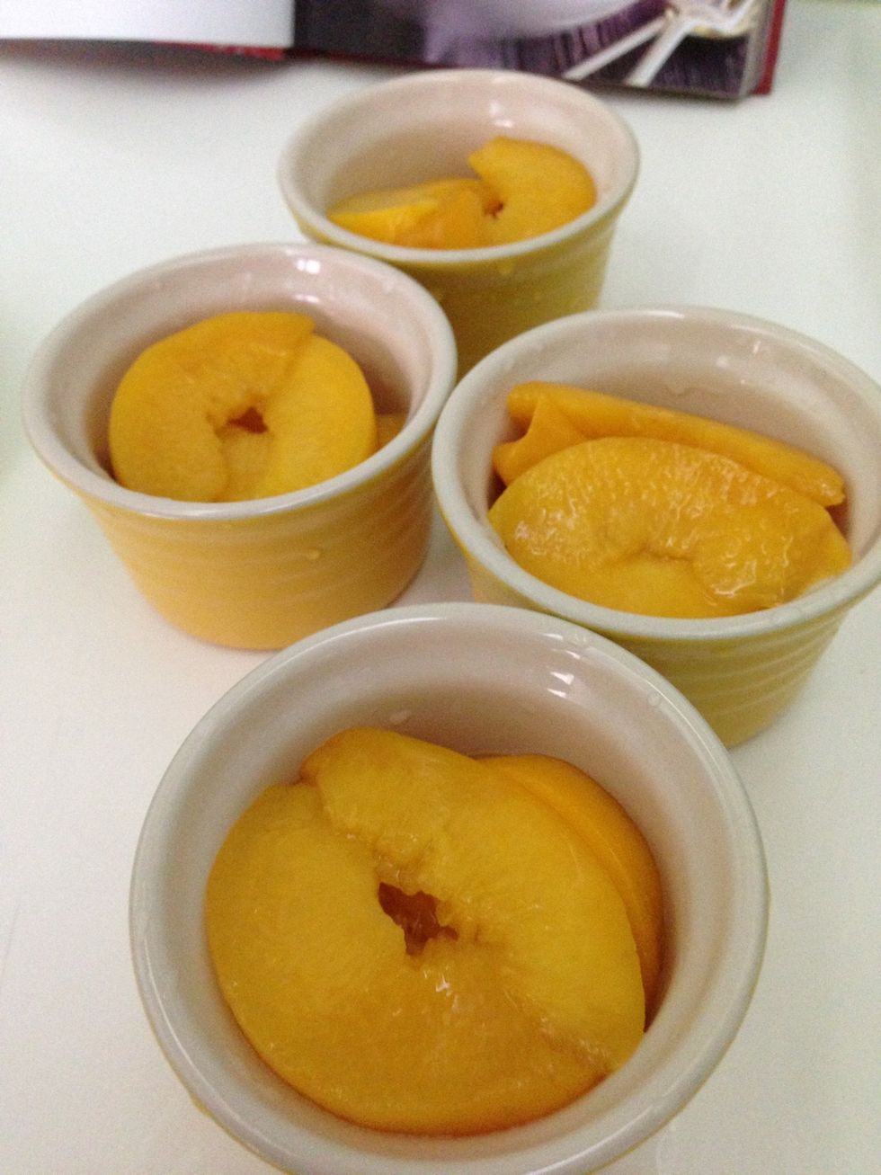 Put peaches in ramekins