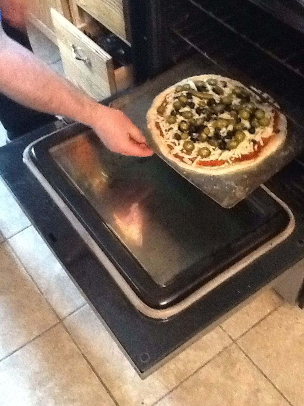 Put pizza in oven.