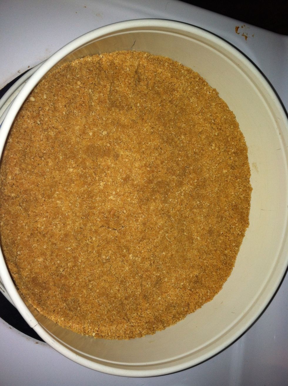 Put pkg of graham crackers in food processor until fine crumbs. Put into springform pan. Melt 4 TBS of butter. Add to crumbs. Mix well & press into pan. Use same steps if using pre crushed crackers.