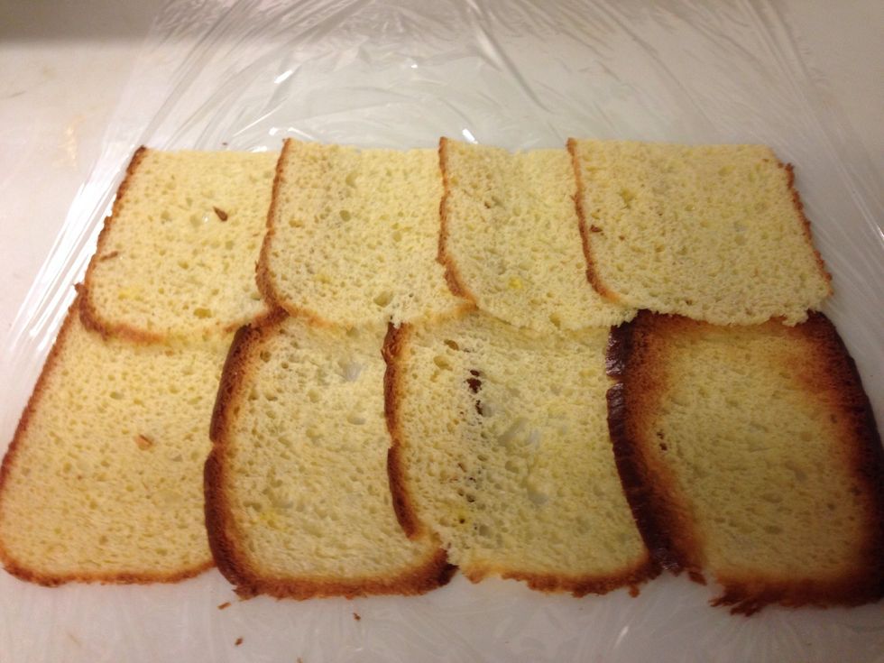Put plastic wrap on the table and the bread on top like in the photo