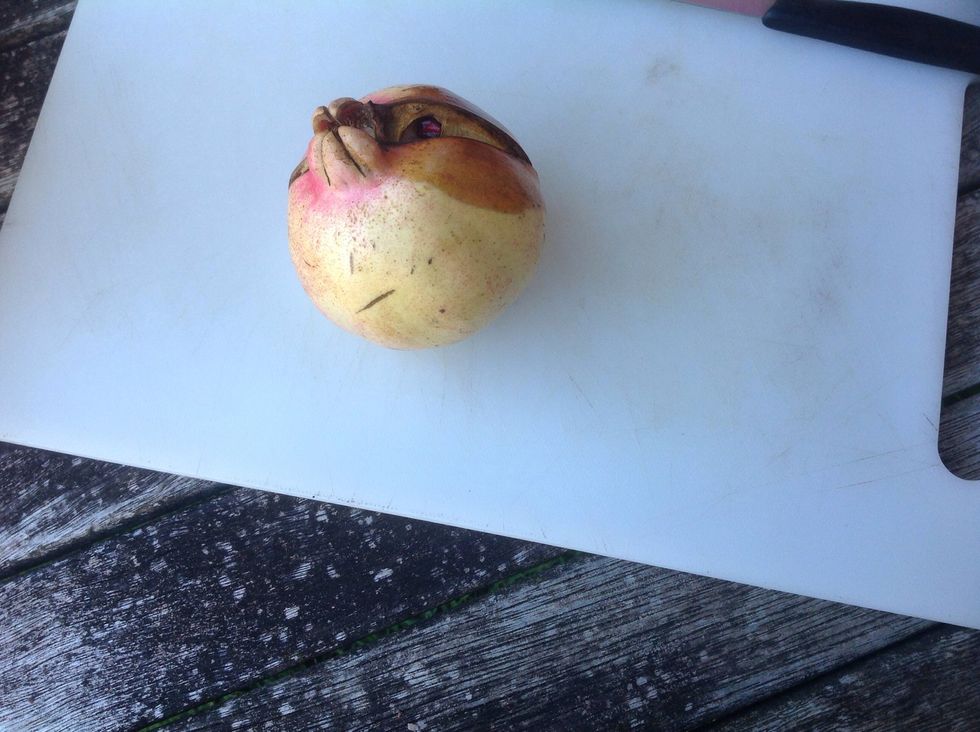 Put pomegranate on chopping board(you may need four or five)