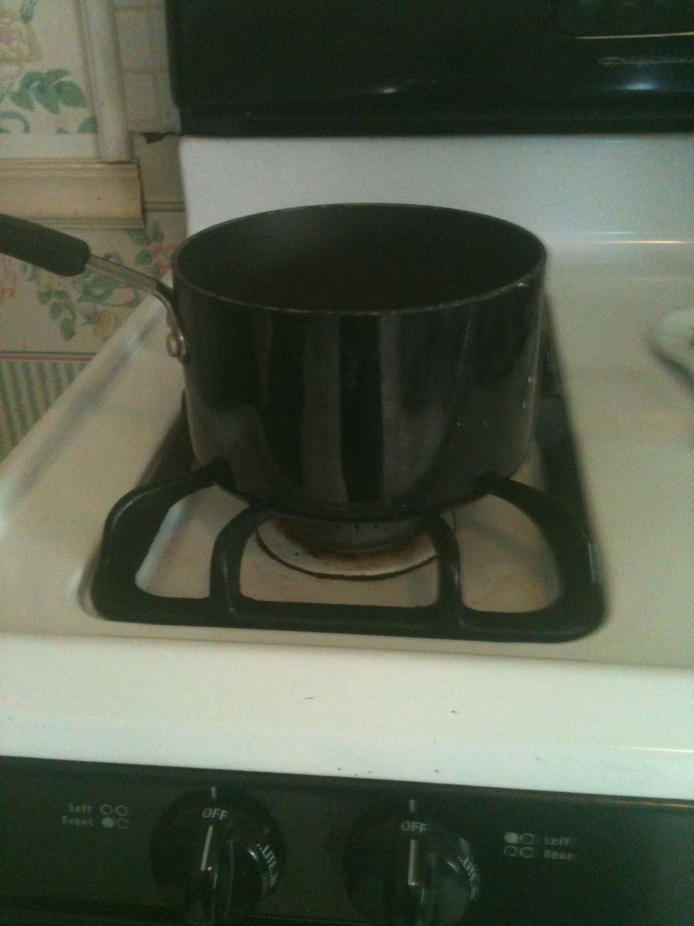 Put pot onto stove and set to 5