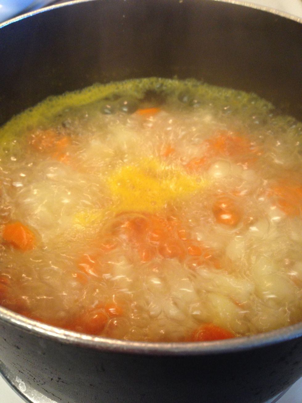 Put potatoes and carrots in sauce pan and cover with water. Bring to a boil, then reduce heat.