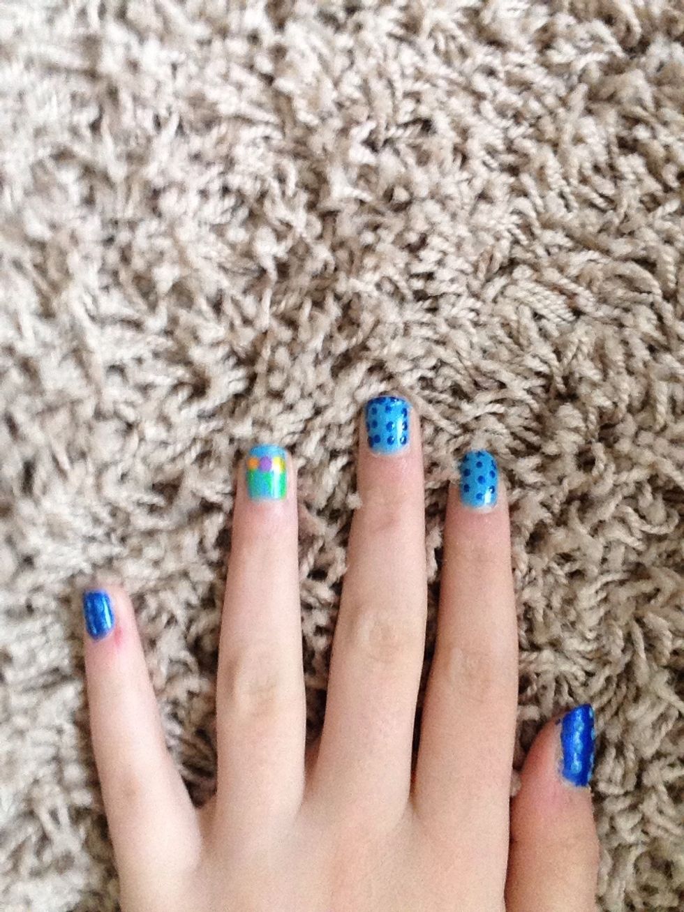 Put purple yellow and orange circles on top of the stems for flowers