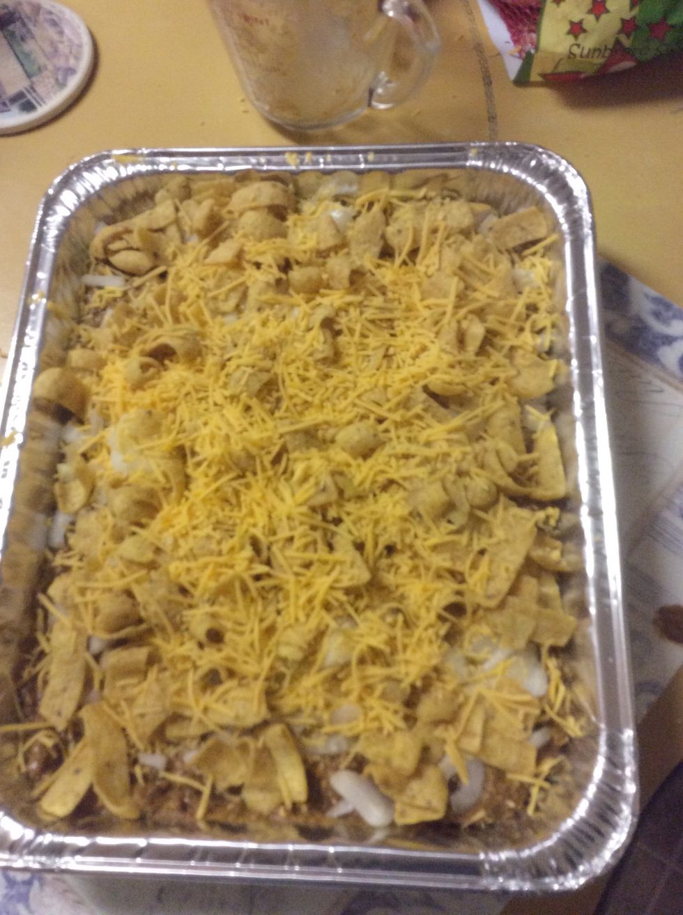 Put remaining Fritos over onions and cheese