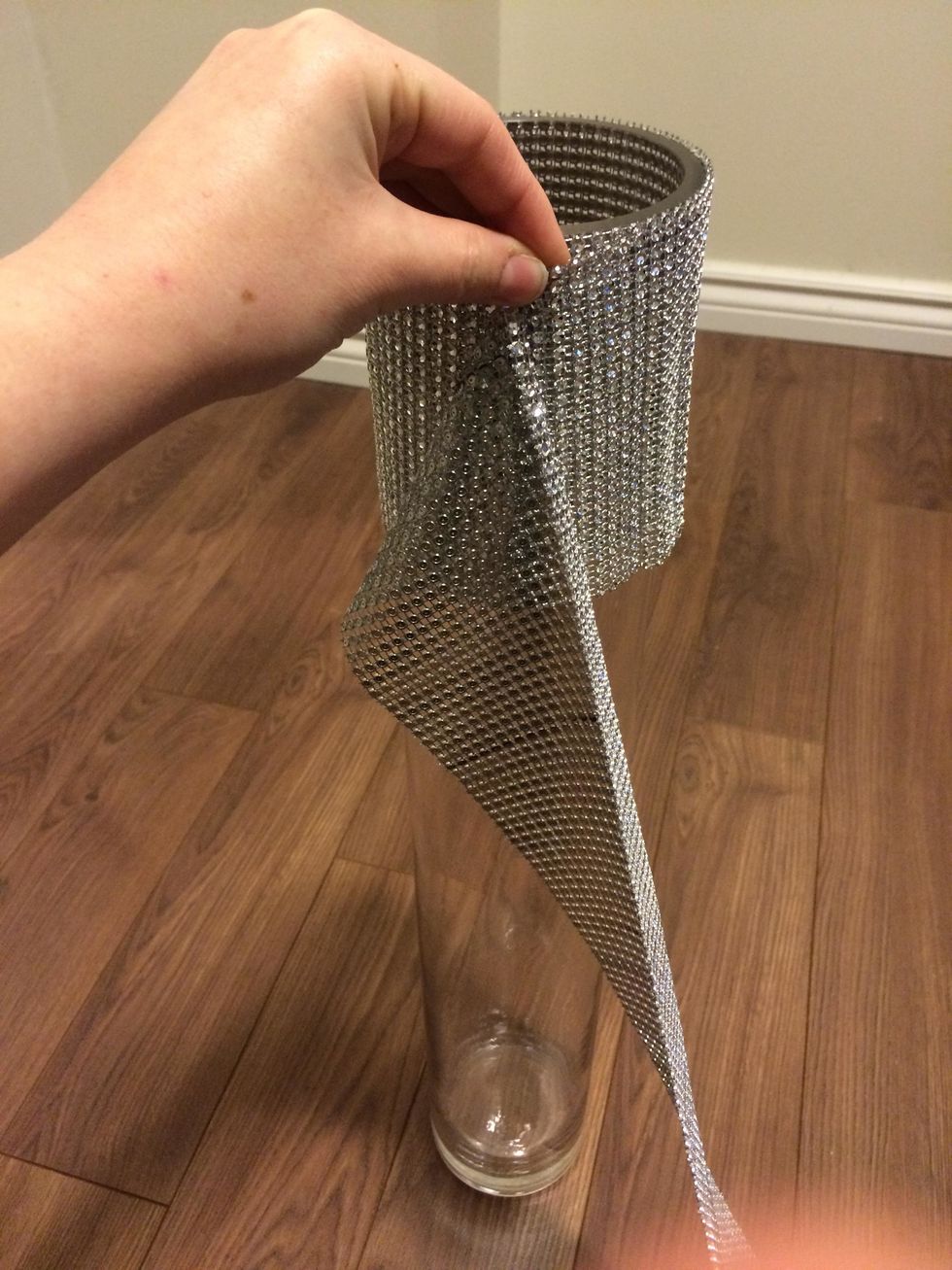 Put rhinestone mesh trim around vase and measure how much you will need to cover. Note: This rhinestone mesh has 24 rows, I cut two rows off to shorten it.