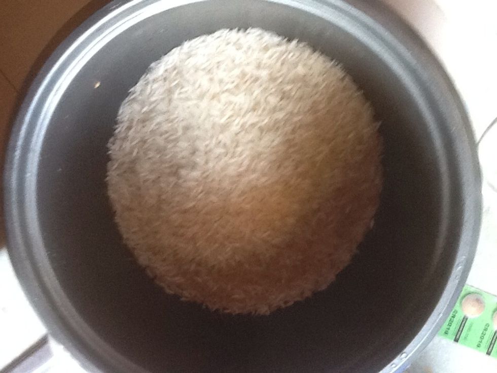 Put rice into rice cooker.