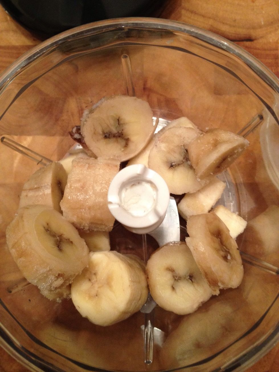 Put slices of frozen banana in the food processor
