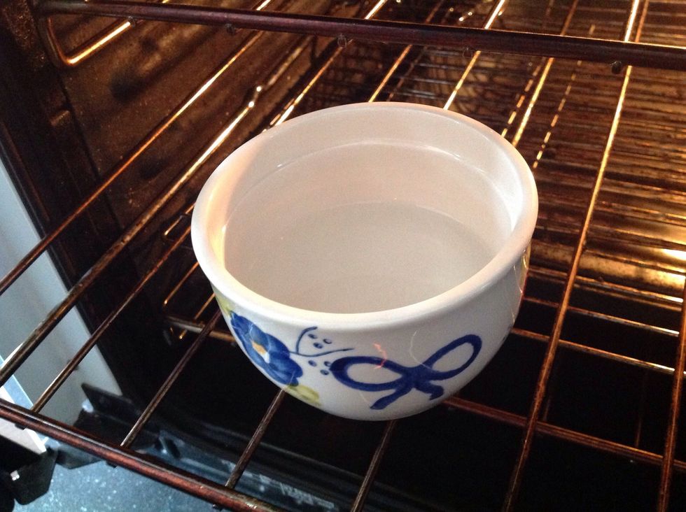 Put small bowl of water in the oven to make a Steamy atmosphere