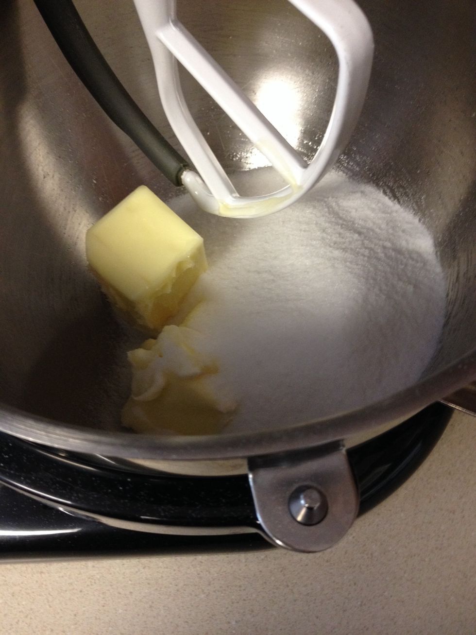 Put softened butter and sugar in mixer and cream together