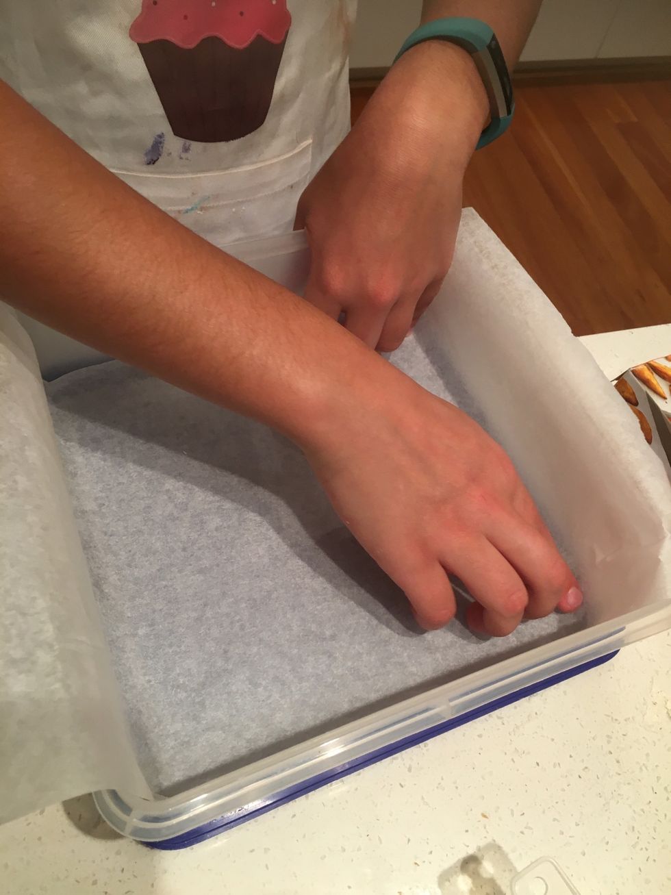 Put some baking paper into a medium sized container to use later.