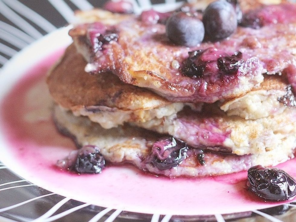 Put some blueberries Ito a bowl with a teaspoon of water and microwave for 20 seconds before drizzling on top of your warm pancakes.
