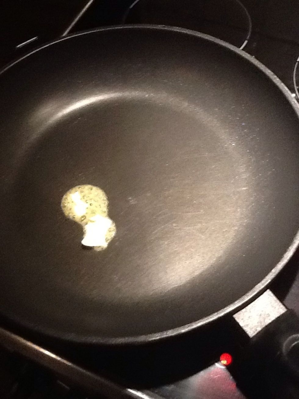 Put some butter in a frying pan.