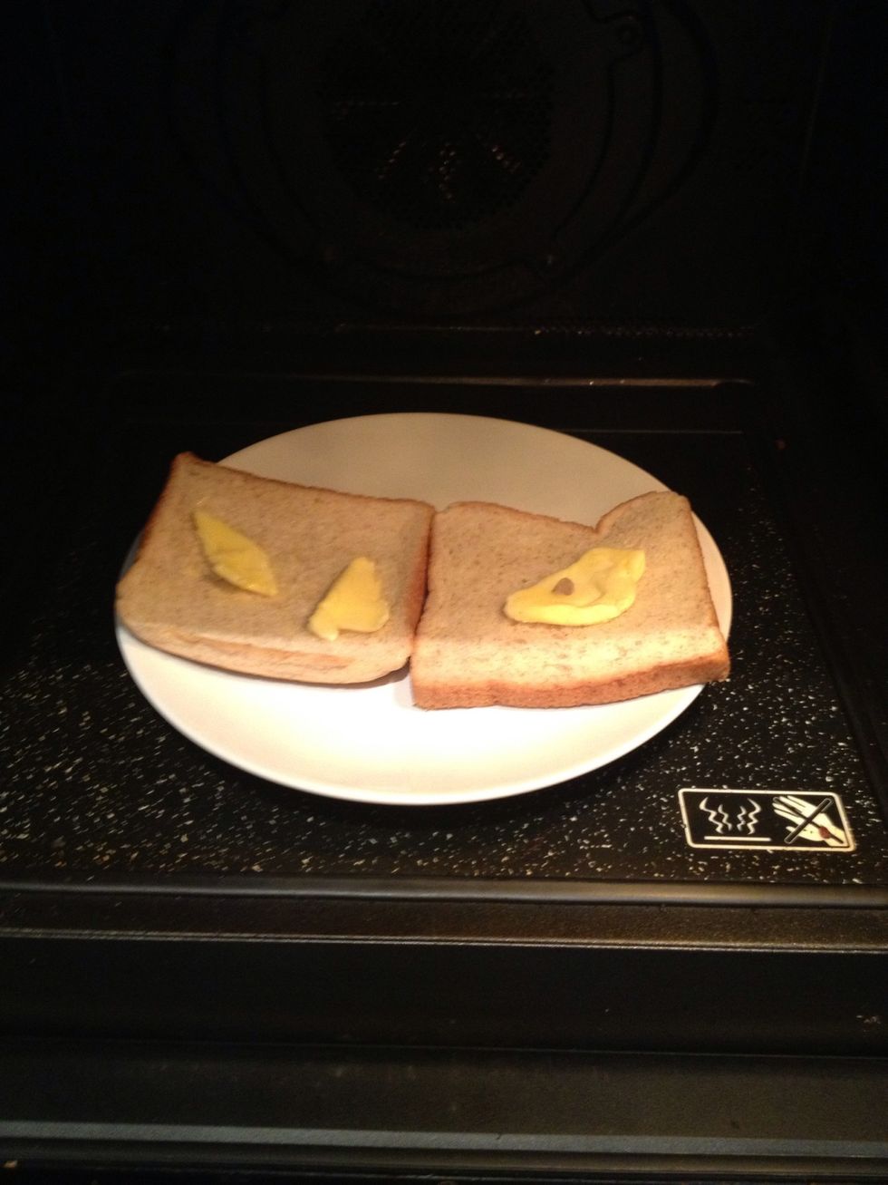 Put some butter on breads. I use wholewheat bread. Put them in the microwave just until the butter melts. (30sec)