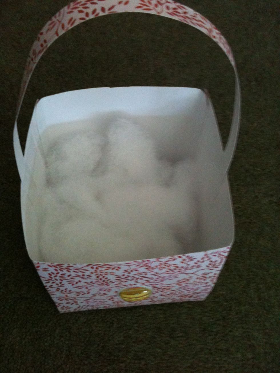 Put some cotton in so it can rest the easter eggs