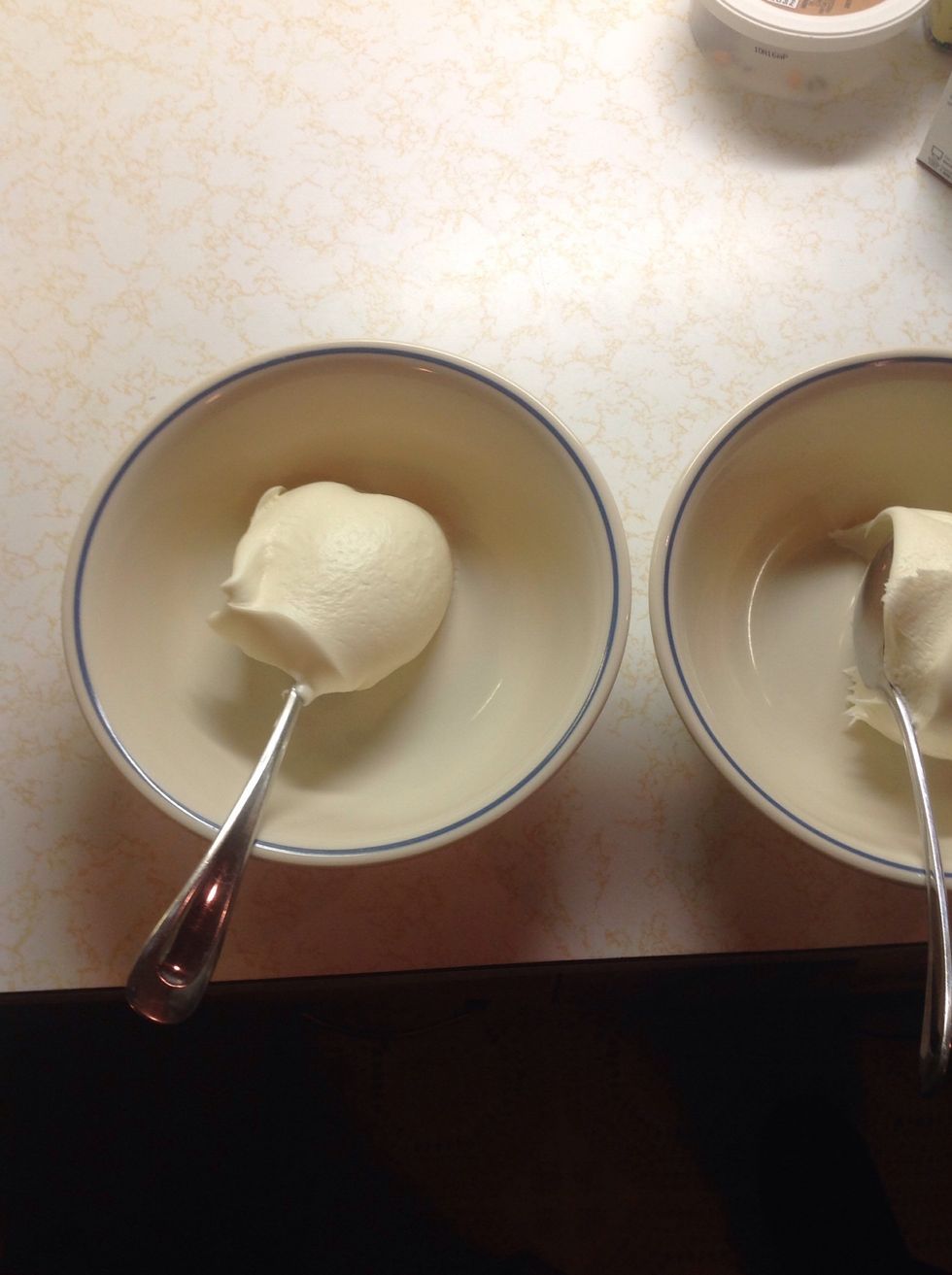Put some cream cheese frosting in a bowl.