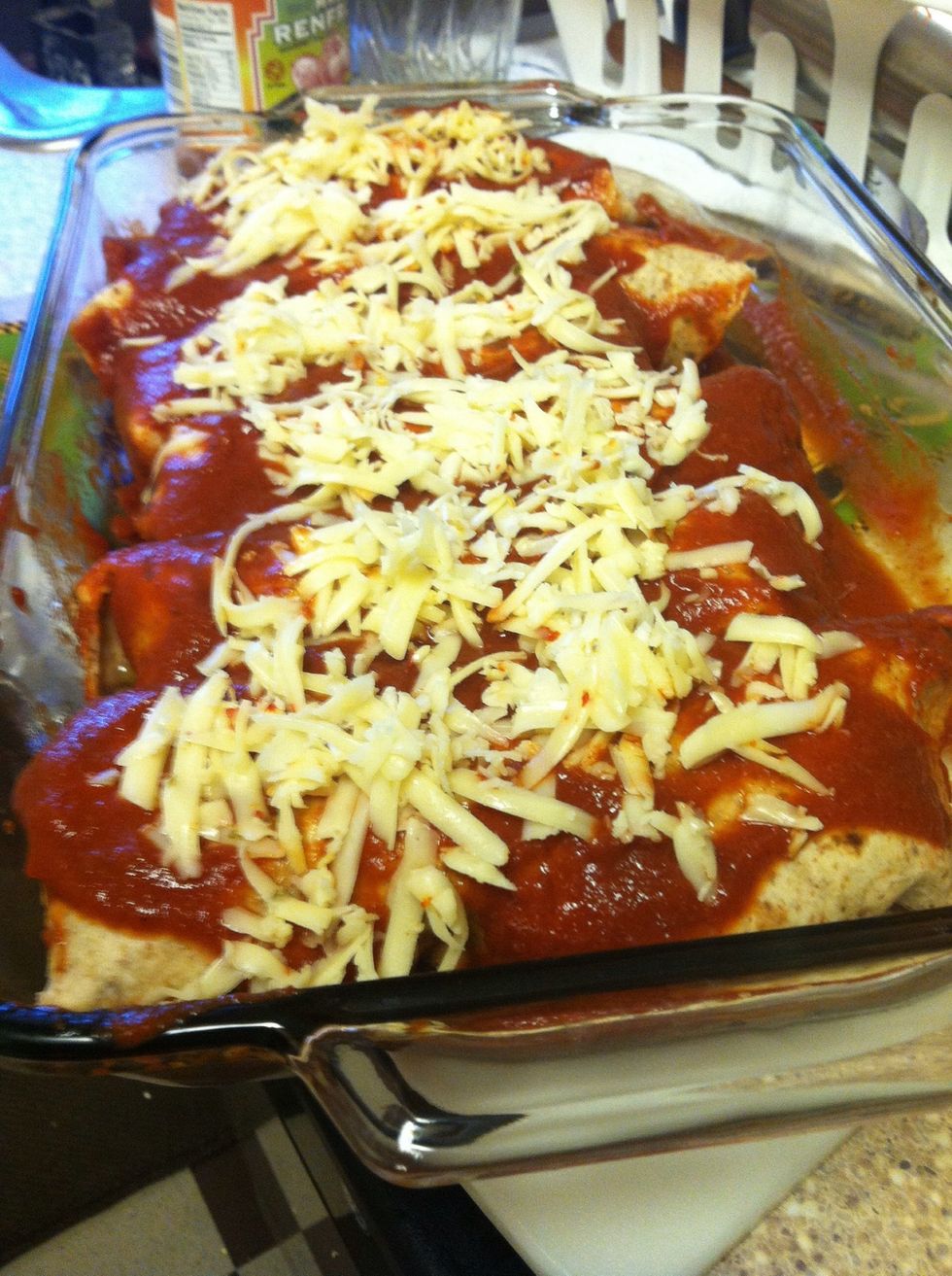 Put some enchilada sauce on the bottom of pan (prevents them from sticking) place your sexy rolled up enchiladas in the pan and pour the sauce on top. Top with cheese. Cover in foil, 20 min in oven.