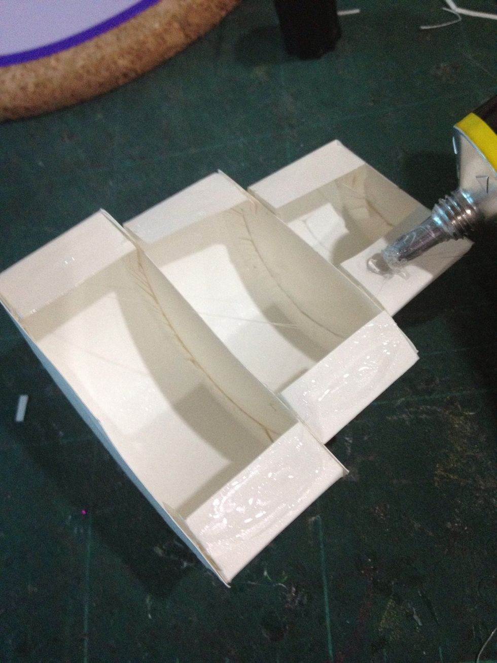 Put some glue at the back of the 'cake'. (that's why it is important to leave 1cm on the left and right! \ud83d\ude04)