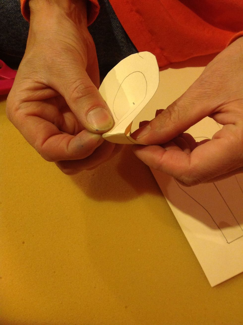 Put some glue between and fold back the tabs