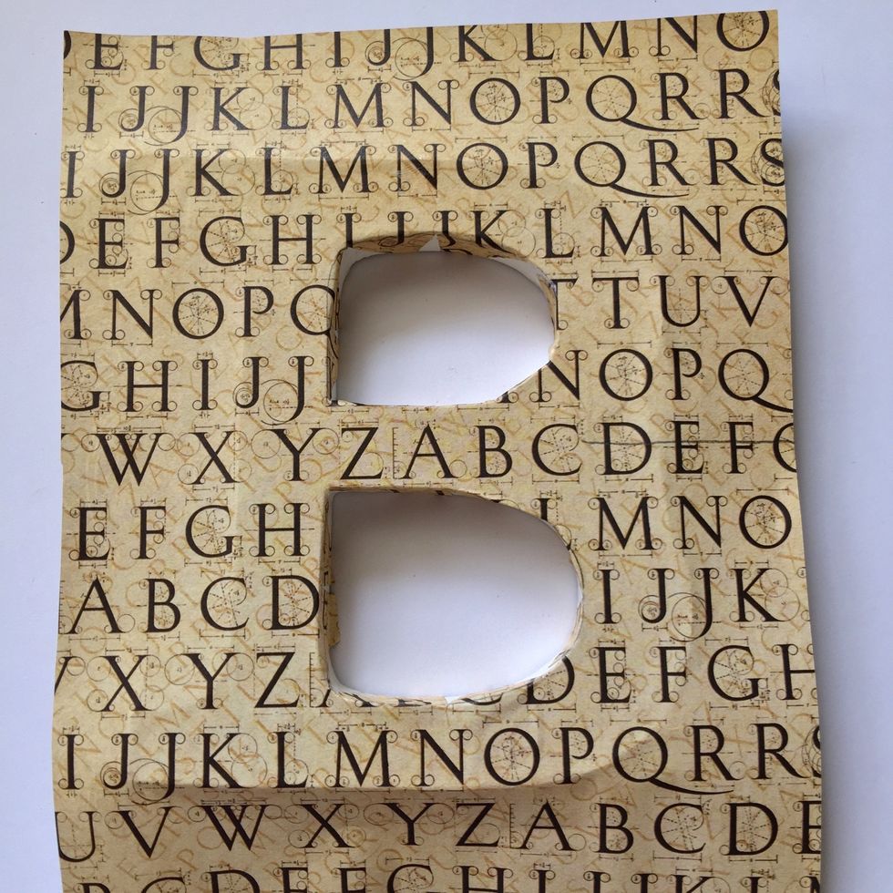 Put some glue inside the holes and glue the paper inside.