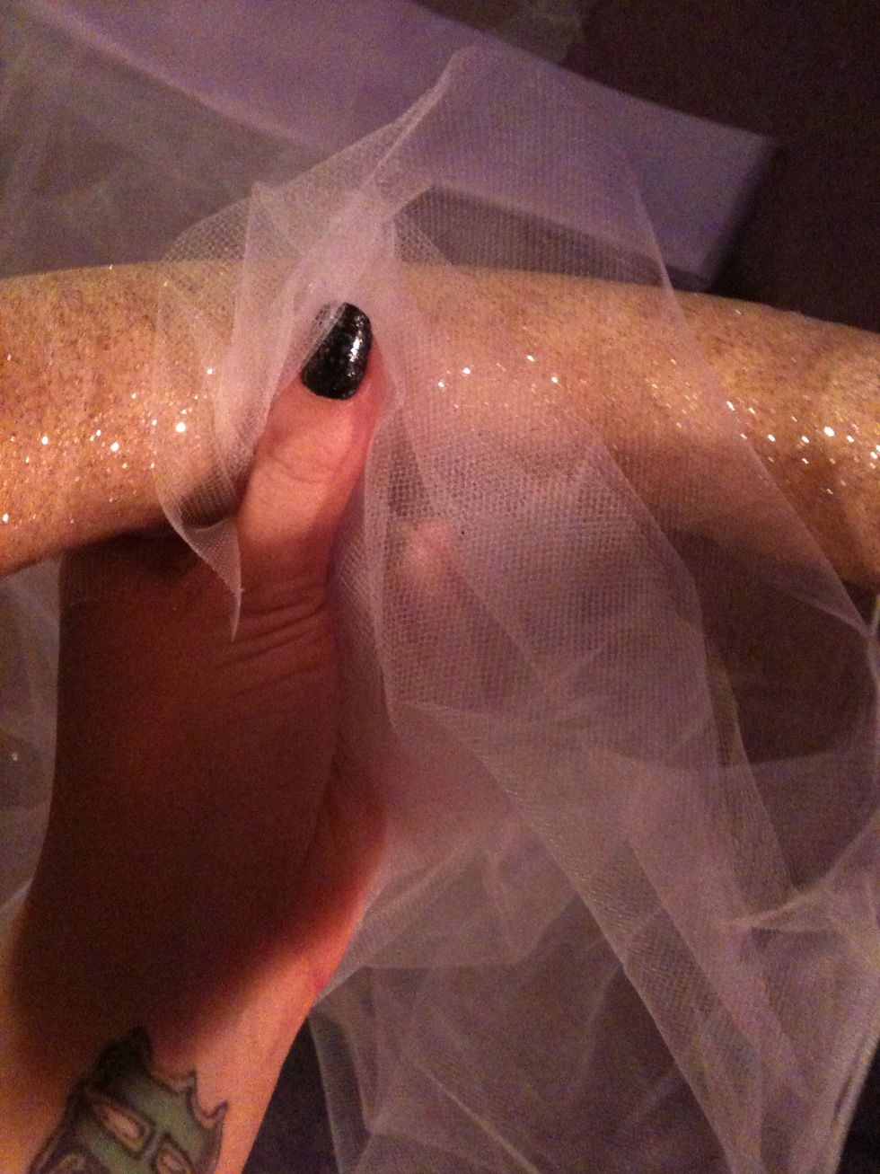 Put some glue on the INSIDE of your ring and then place the tulle on top lightly pressing down. Careful, it WILL be hot!!