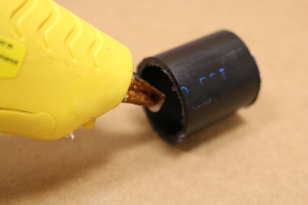 Put some hot glue in the PVC tube to hold the motor inside it.