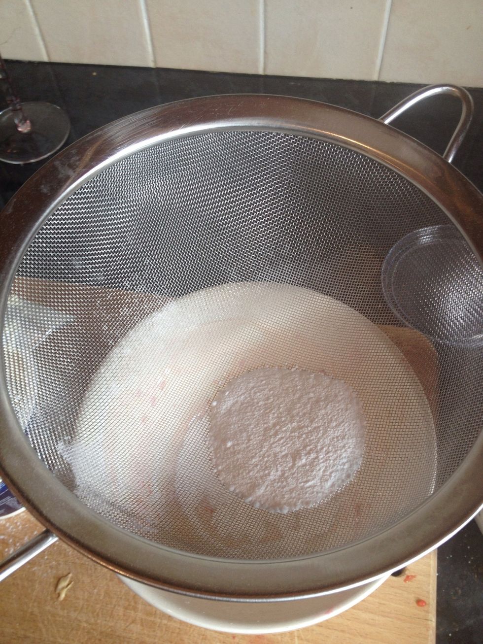 Put some icing sugar in a sieve. Shake over the top if cake. Decorate with extra raspberries, securing them with a dap of whipped cream.