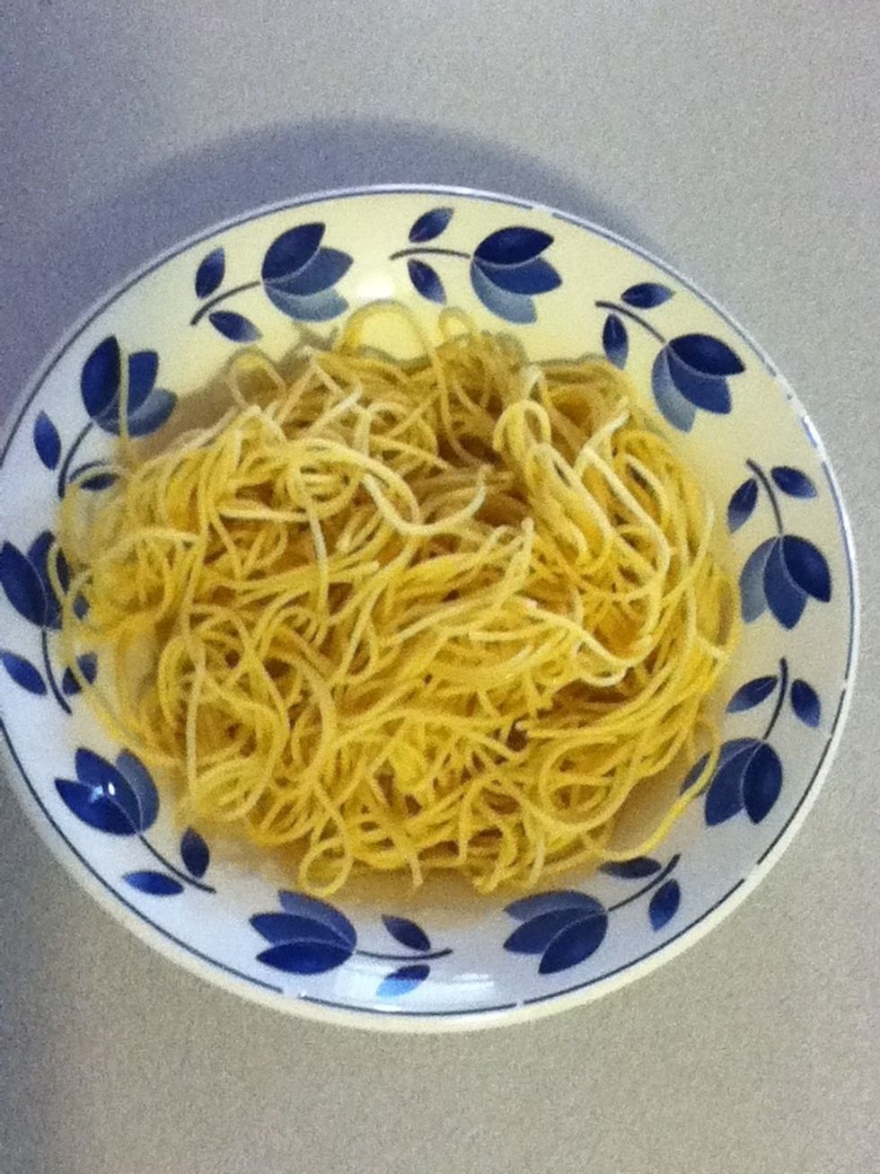 Put some leftover spaghetti noodles into a bowl and pop it in the microwave for a minute or so.