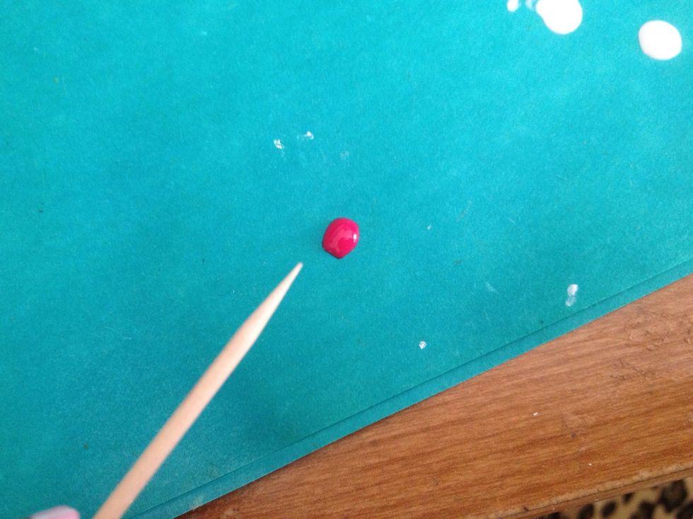 Put some of the dark pink nail polish on a paper and prepare your toothpick