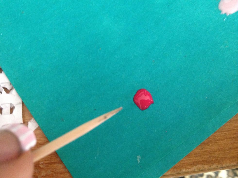Put some of the dark pink nail polish on the paper and prepare your toothpick