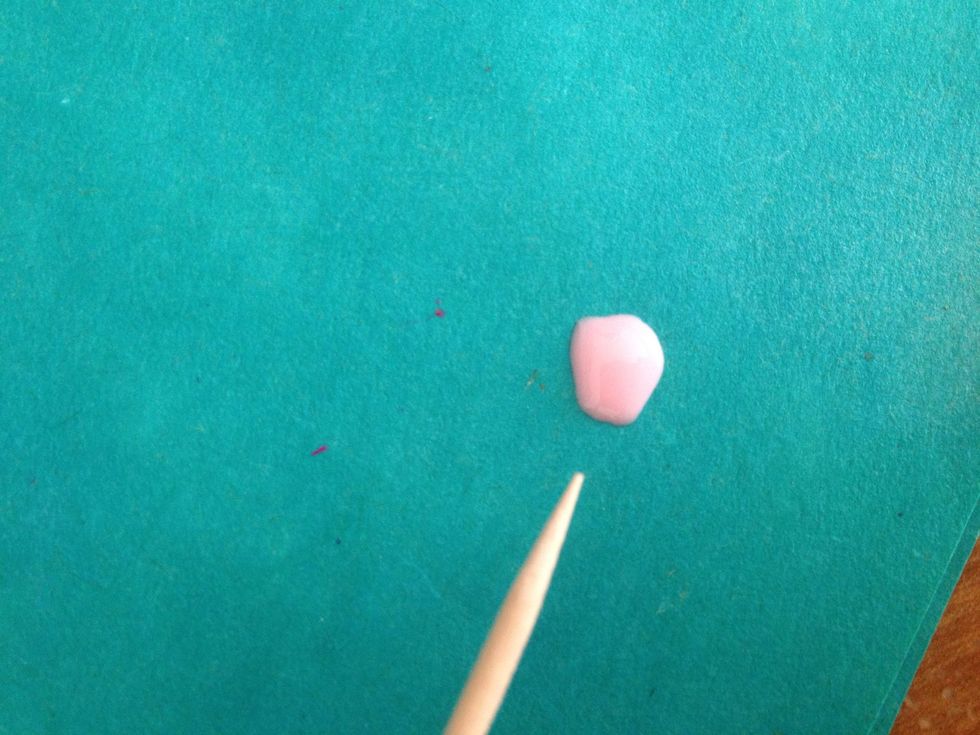 Put some of the light pink nail polish on a paper and prepare the toothpick