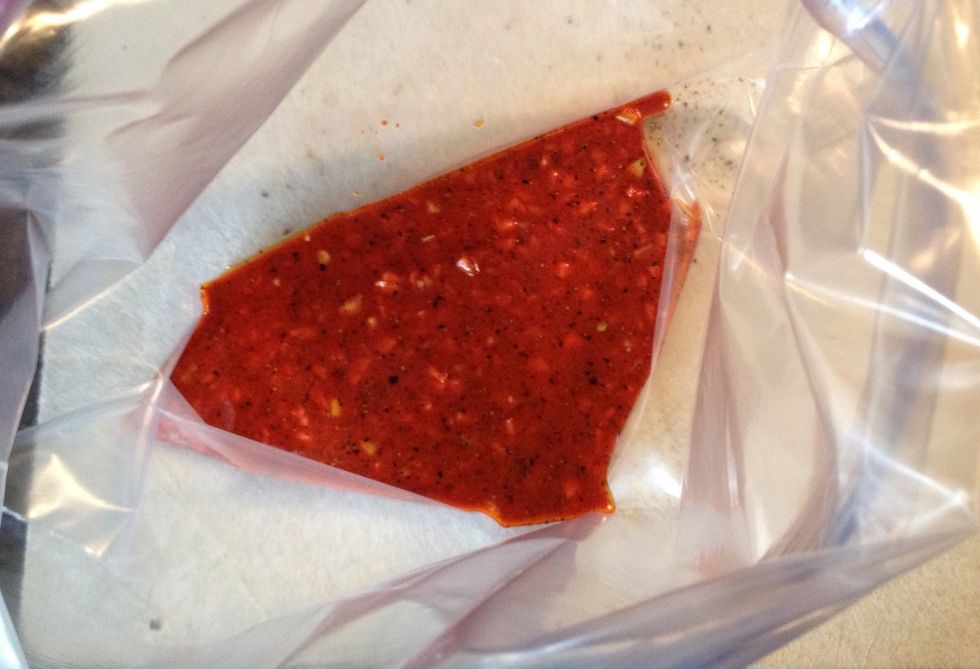 Put some of the marinade into the bottom of a zip bag and start adding the chicken thighs.