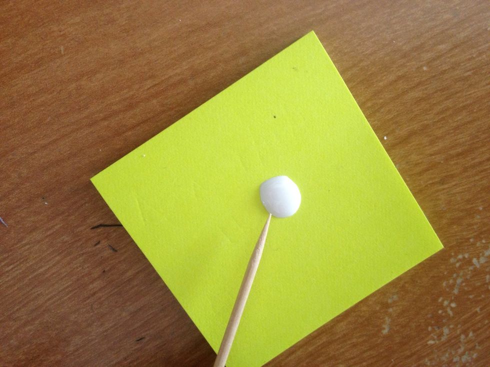 Put some of the white nail polish on a paper and with the toothpick add some stripes on the nail with light pink nail polish