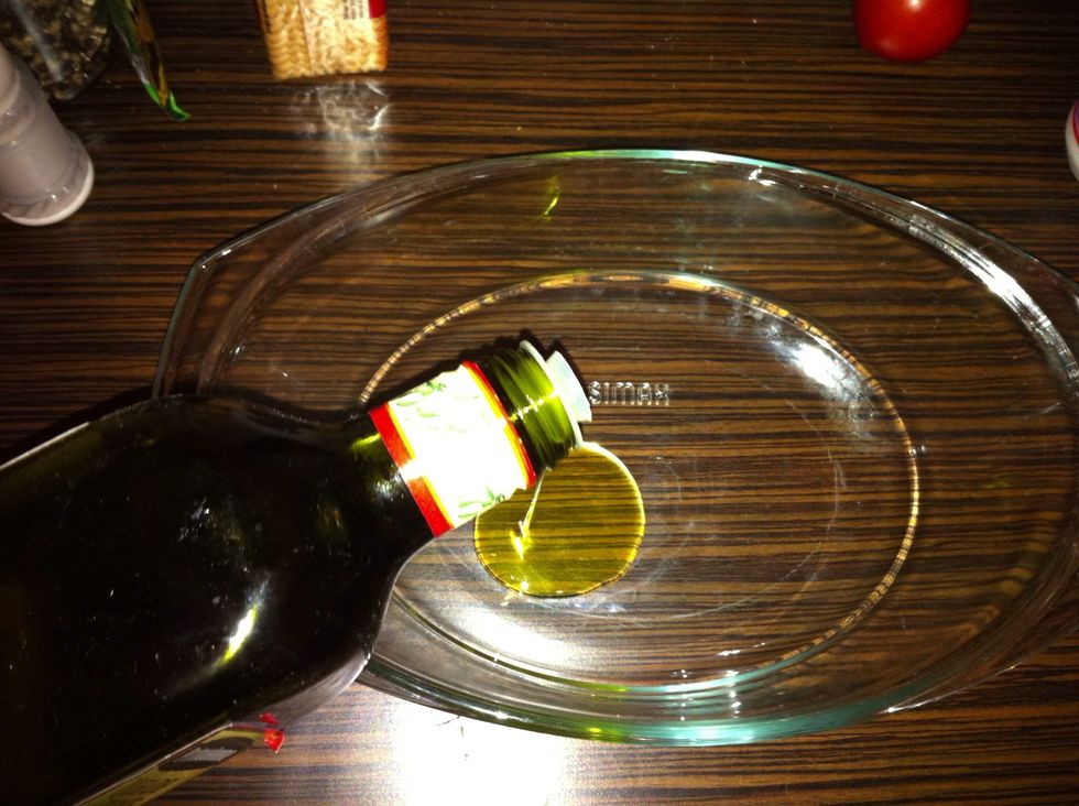 Put some olive oil in a heat resistant vessel.