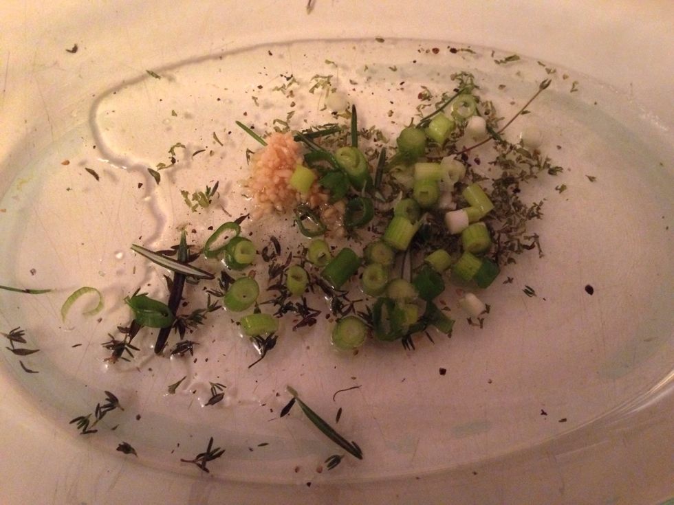 Put some olive oil, parsley, green onion, garlic, butter, and a little Paul Newsman's light balsamic dressing Ina glass oven safe pan and stir