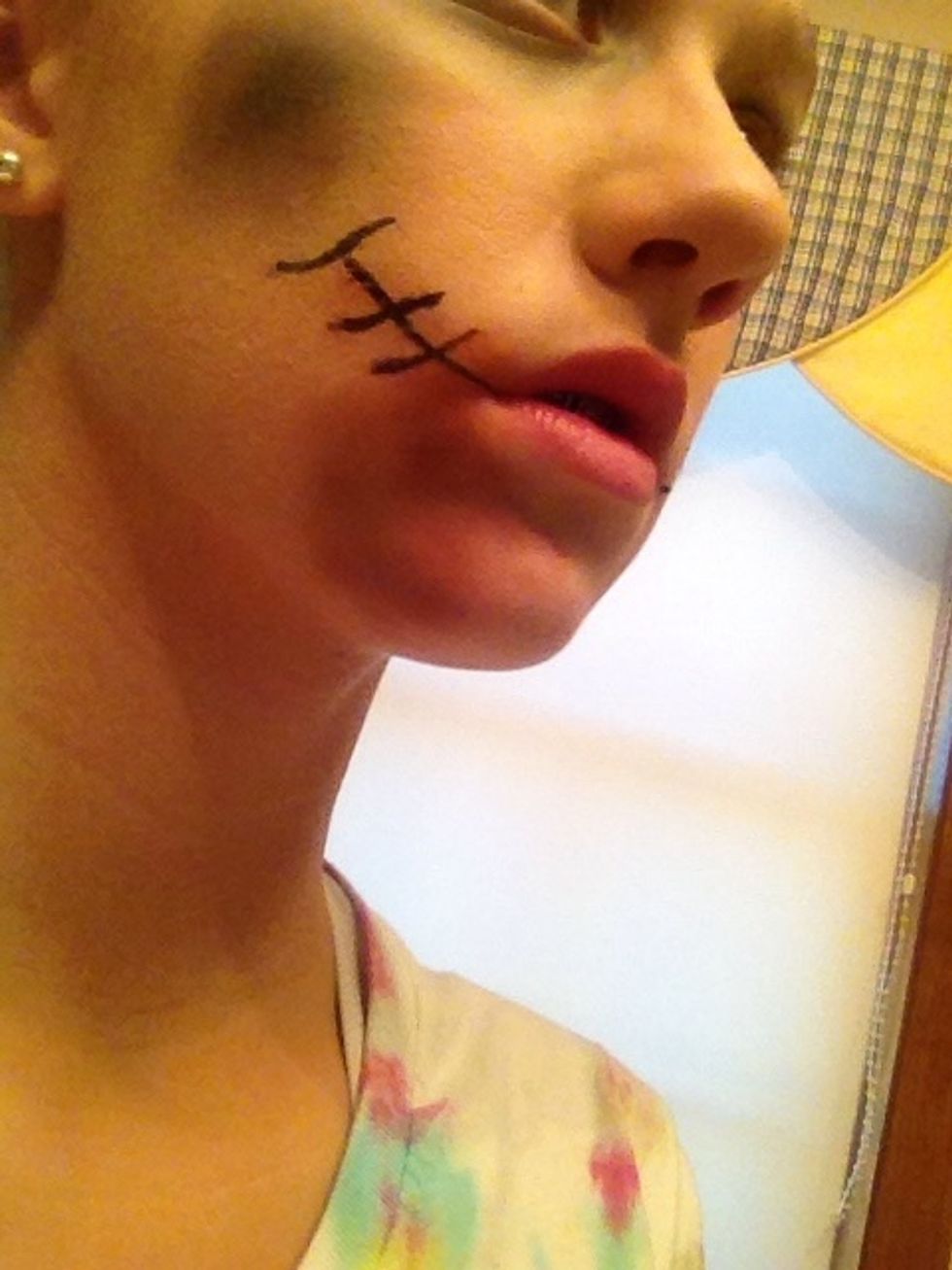 Put some red eyeshadow around the mouth.