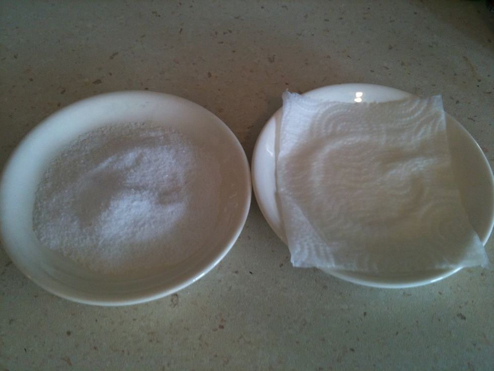 Put some salt to a plate and a wet towel to another