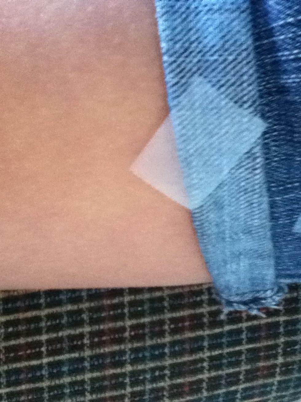 Put some tape on fabric (this way it's less sticky)