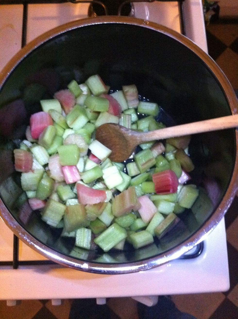 Put some water into the pot to cover the bottom and cook the rhubarb.