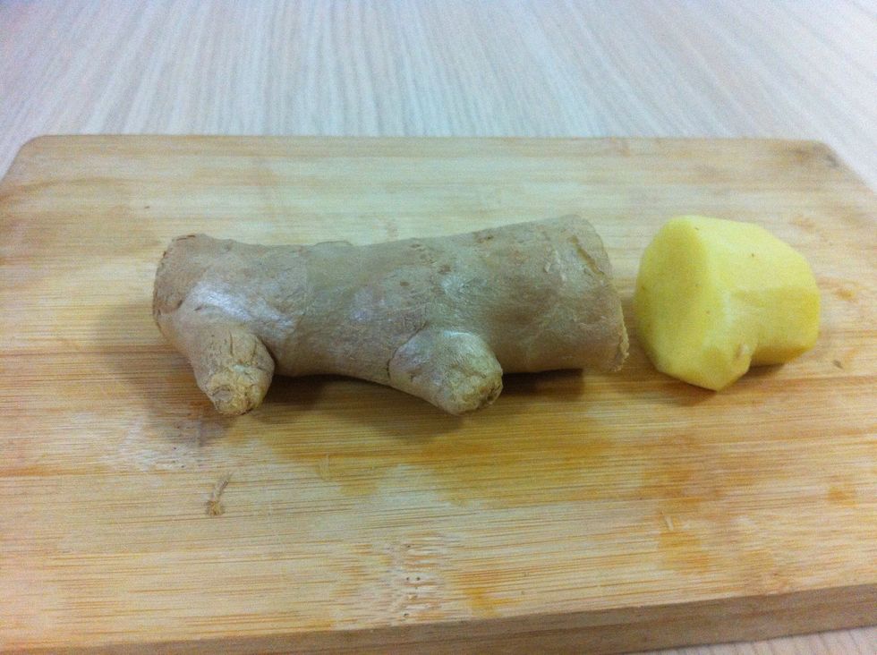Put some water on to boil. Then cut off a 2-3 inch section of the ginger and peel it.