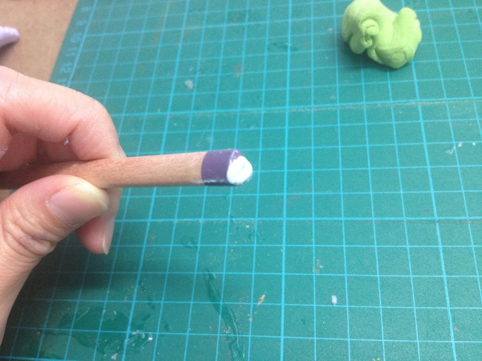 - Put some white glue on the tip of the pencil.