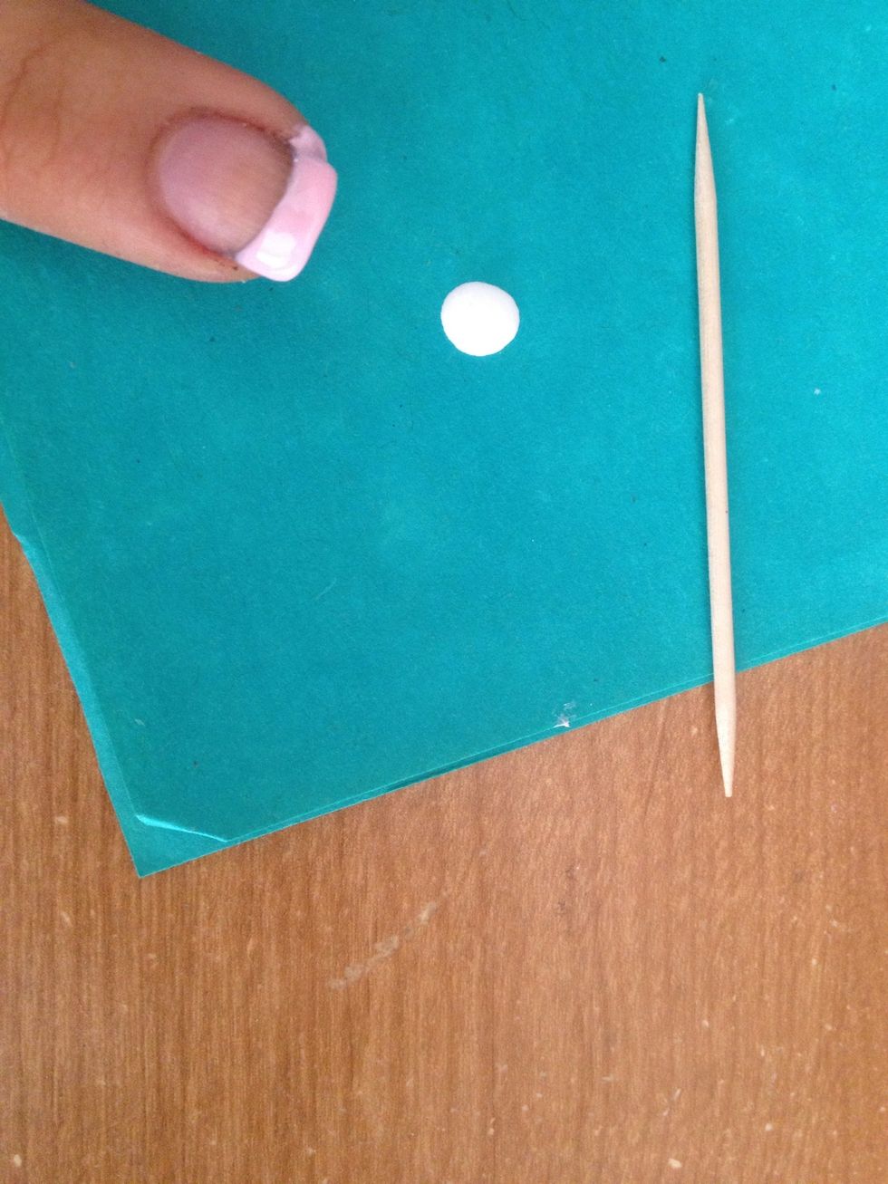 Put some white nail polish on a paper and with the toothpick add some stripes with one of the nails with light pink nail polish