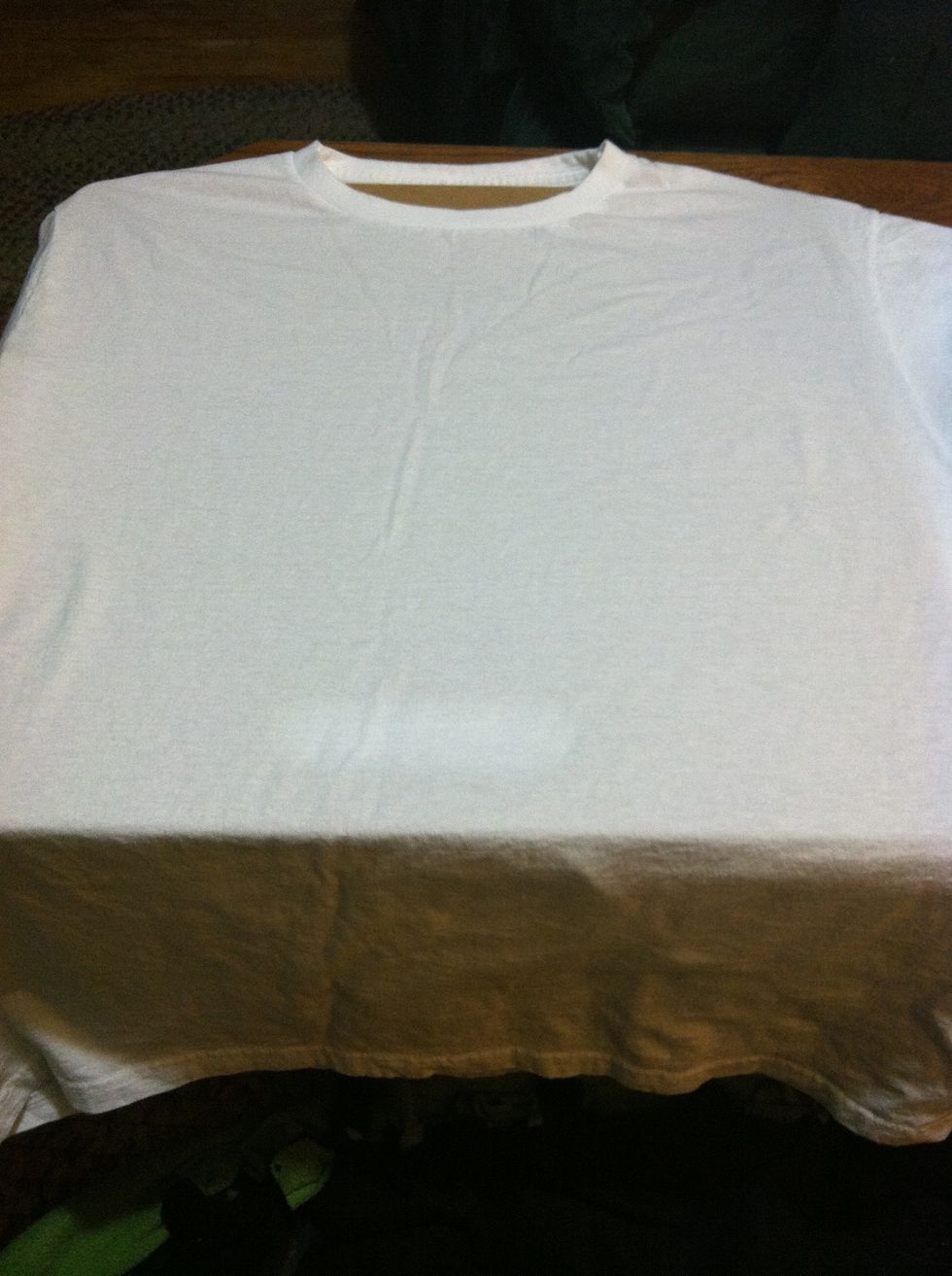 Put something (that won't melt) inside your shirt. I used my big drawing board but a wooden cutting board or a towel works really well too. If you have an ironing board use that.