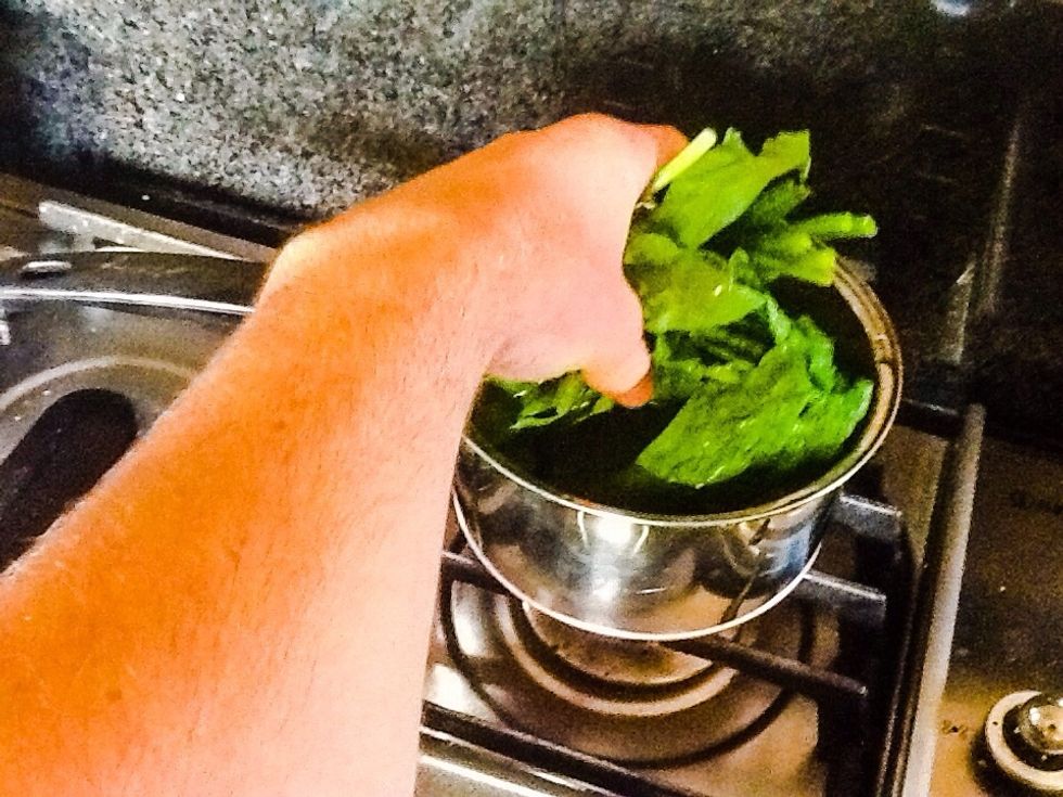 Put spinach in boiling water over medium until soft